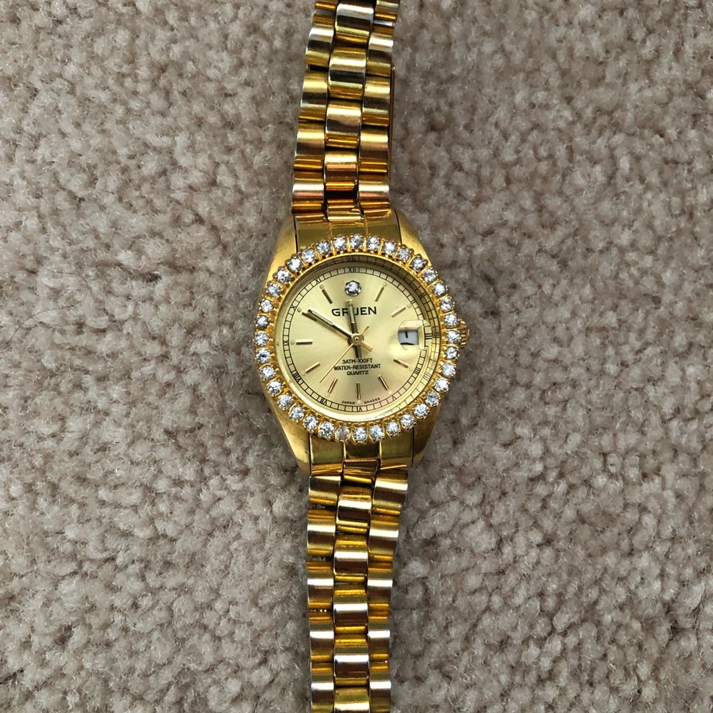 Gruen gold toned diamond bezel stainless steel ladies watch